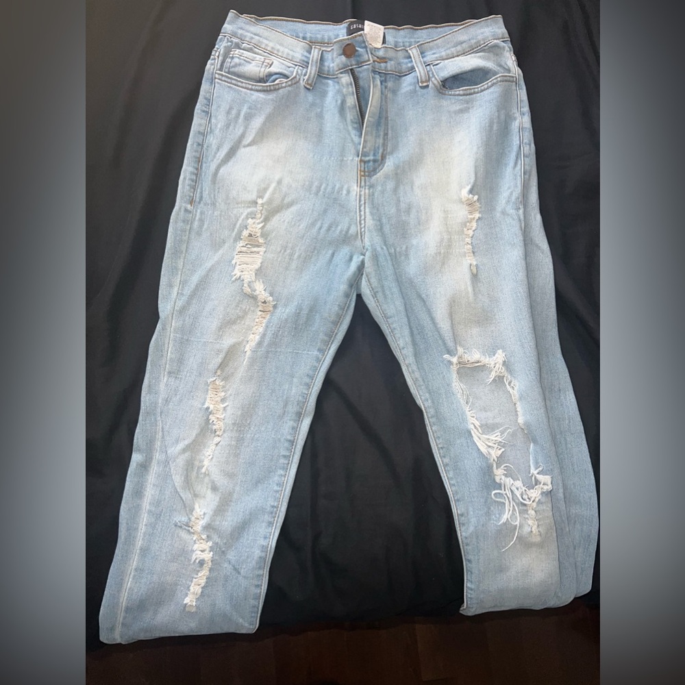 Ripped light blue jeans